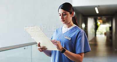 Buy stock photo Nurse, reading and woman with documents, hospital and info for medical diagnosis, serious and report. Check, patient history and person with paperwork for treatment plan, folder or healthcare records