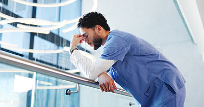 Buy stock photo Nurse, man and sad with stress in clinic for grieving loss, operation failure and medical trauma. Low angle, health professional and unhappy in hospital hallway for healthcare crisis and overwhelmed