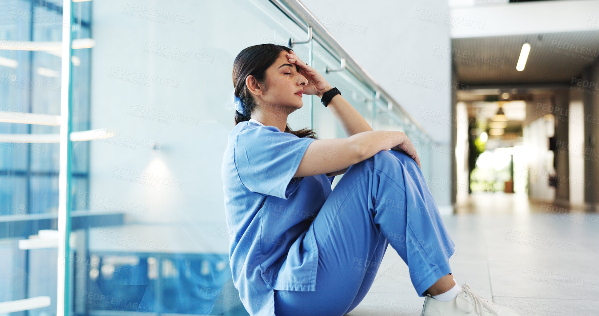 Buy stock photo Nurse, woman and stress on hospital floor with healthcare crisis, medical mistake or treatment fail. Mental health, nursing intern and overwhelmed in clinic hallway for patient loss, anxiety or worry