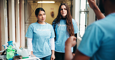 Buy stock photo Women, volunteer and listen for cleaning, corridor maintenance and facility hygiene. People, explain and supplies for hallway cleanliness, ngo outreach and sanitation project of social responsibility