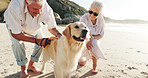 Beach, happy and senior couple with dog for walking, adventure and bonding on weekend. Marriage, retirement and elderly man and woman with Golden Retriever by ocean for exercise, wellness and health