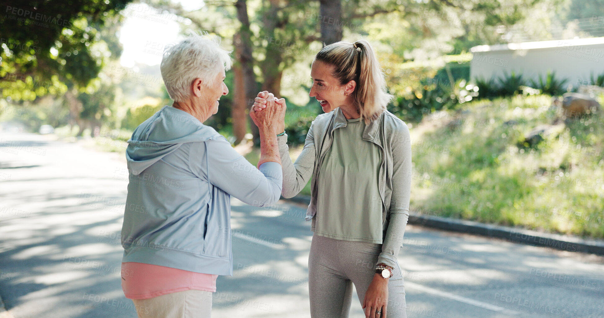 Buy stock photo Senior woman, personal trainer or fitness with high five in road for achievement or workout exercise. Elderly, female person or coach with smile for winning, success or physical activity together
