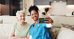 Selfie, smile or support with nurse and old woman on sofa in living room of home together for memories. App, medical and photograph of caregiver with senior patient in apartment for healthcare visit