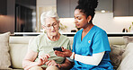 Caregiver, help or old person on sofa with phone, guidance or learning on wellness app. Digital, advice or elderly  woman in house with support, teaching or technology assistance on telehealth site