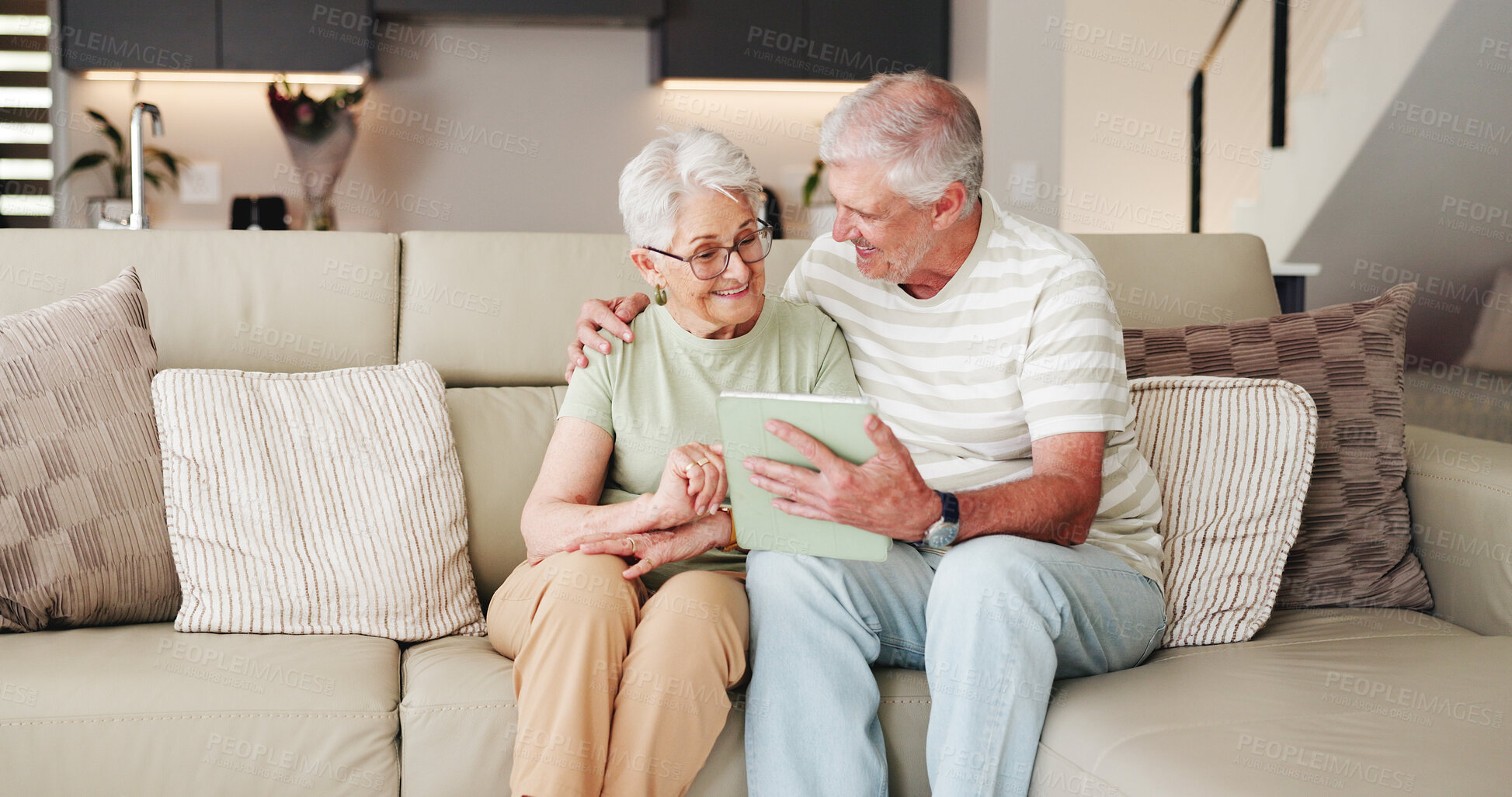 Buy stock photo Senior couple, relax and hug with tablet on sofa for bonding, entertainment or streaming in home. Elderly, man and woman with smile on technology for network, subscription or app on couch in house