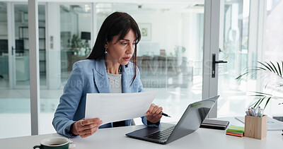 Buy stock photo Woman, reading and paperwork in office with laptop for financial statement, budget proposal and report. Mature person, computer and document with review for finance management, planning and research.