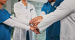 Group, nurses and doctors with handstack in hospital for celebration, surgery success and victory. People, healthcare workers and huddle for medical milestone, staff motivation and team achievement