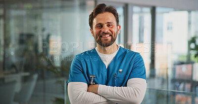 Buy stock photo Portrait, smile and nurse with arms crossed in hospital for career pride, about us and medical service. Happy, man and job ambition for healthcare assistance, patient care and confidence for wellness