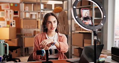 Buy stock photo Jewelry, influencer and ecommerce with woman in warehouse for startup, promotion and chat. Content creation, online shopping ambassador and live stream with person and accessory for broadcast 