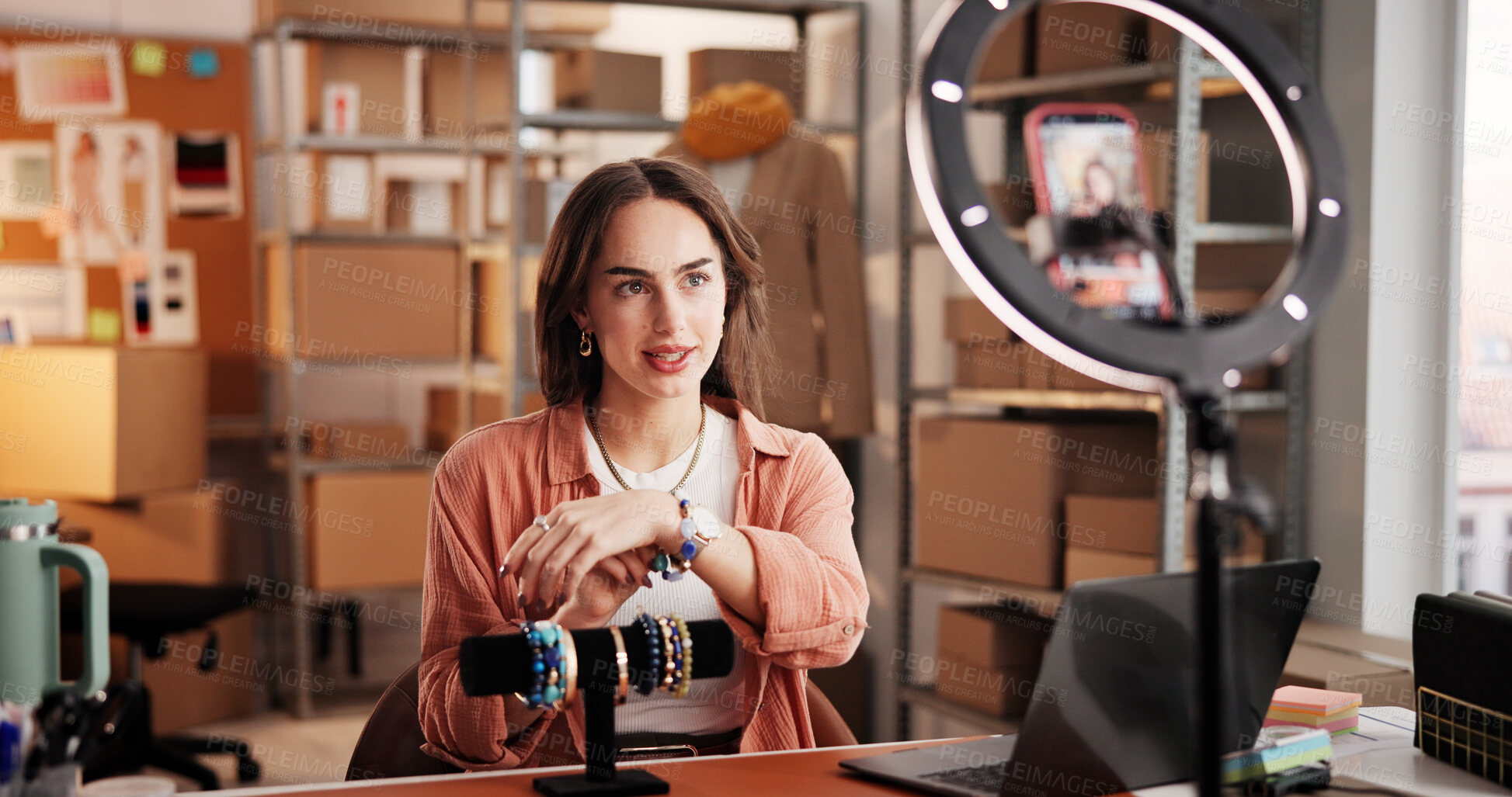 Buy stock photo Jewelry, influencer and ecommerce with woman in warehouse for startup, promotion and chat. Content creation, online shopping ambassador and live stream with person and accessory for broadcast 