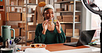 Sunglasses, ecommerce and promotion with black woman in warehouse for startup, influencer and ring light. Content creation, online shopping broadcast and live streaming with person and accessory