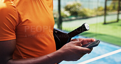 Buy stock photo Hands, phone and scroll at tennis court for exercise, contact and racket for padel game at urban park. Person, smartphone and texting with mobile app, gear and outdoor for fitness at sports club
