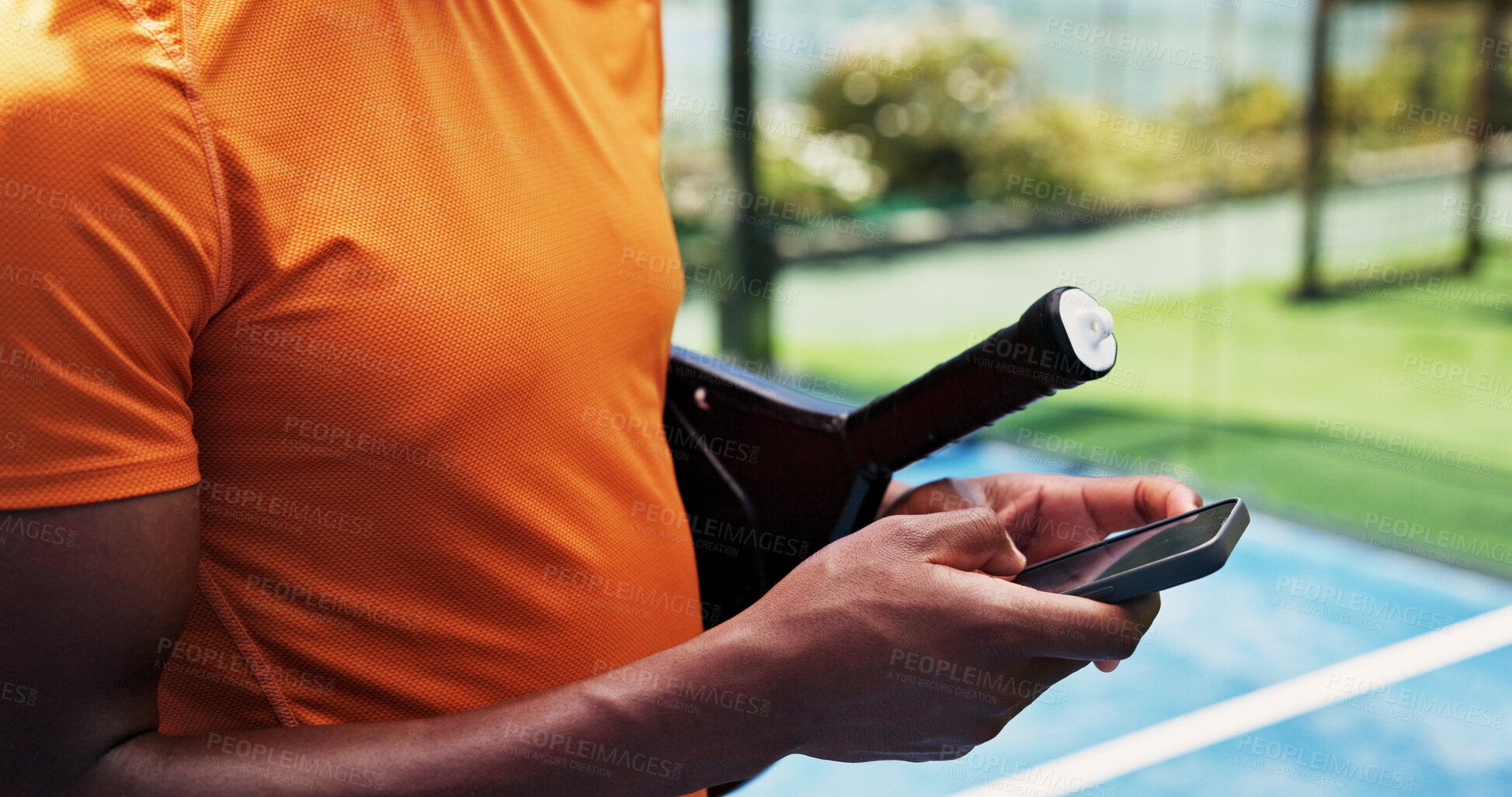 Buy stock photo Hands, phone and scroll at tennis court for exercise, contact and racket for padel game at urban park. Person, smartphone and texting with mobile app, gear and outdoor for fitness at sports club