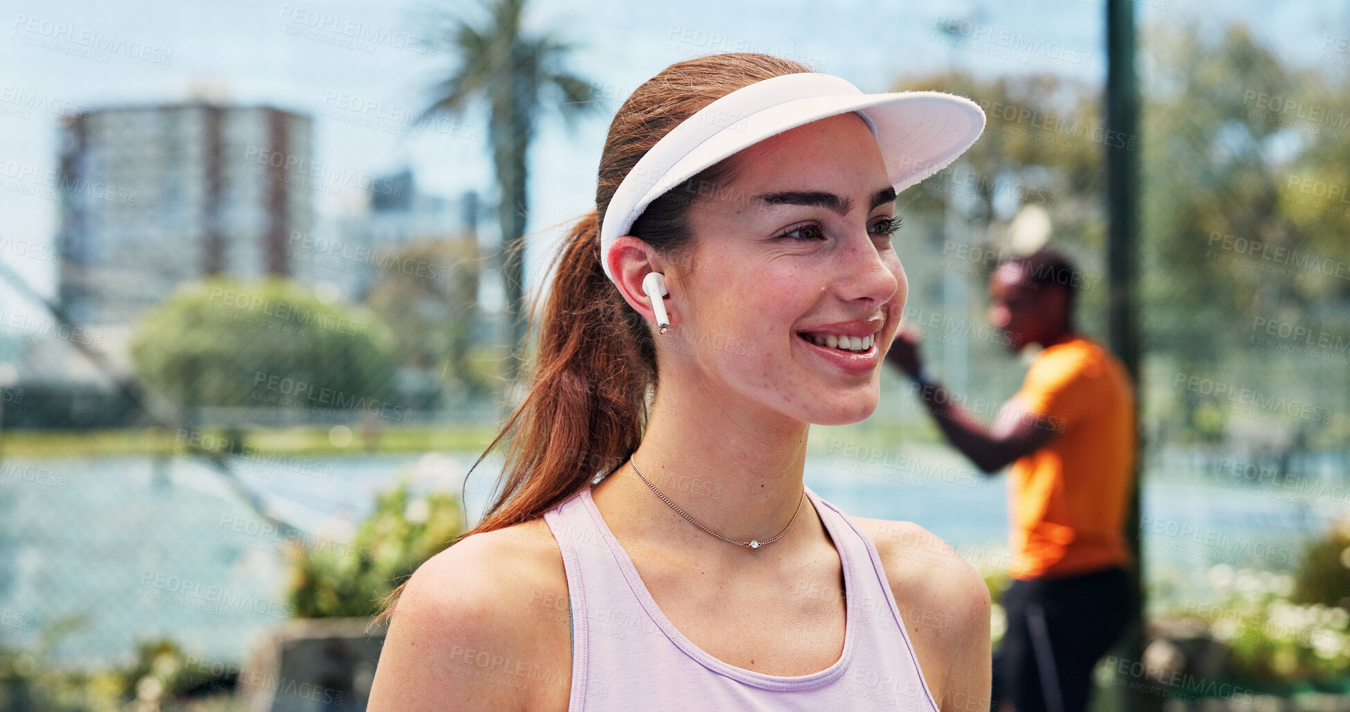 Buy stock photo Woman, earphones and music with smile at tennis court, audio or break for streaming at urban park. Person, sound and listen to radio for exercise, subscription or training for fitness at sports club