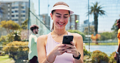 Buy stock photo Woman, phone and texting with smile at tennis court, fitness or break for web chat at urban park. Person, athlete and smartphone on mobile app, social media or happy with training at sports club