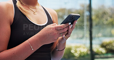 Buy stock photo Fitness, typing and hands on court with phone, message update or exercise post on social media. Digital, woman and athlete outdoor with mobile, wellness chat or virtual tutorial on training break.