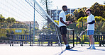 Fitness, friends and talking outdoor with tennis racket for wellness, match or competition practice. Low angle, people or athletes on court with equipment for game plan, sports conversation or start.