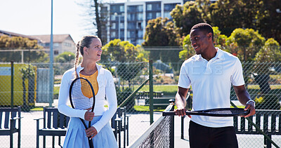 Buy stock photo Fitness, friends and conversation outdoor with tennis racket for wellness, match or competition practice. Active, people or athletes on court with equipment for game plan, sports discussion or start.