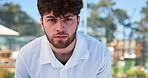 Portrait, tired and man with fitness, padel and sports game with training, wellness and exhausted. Cardio, tennis player and healthy person with break, fatigue and resting with exercise and contest