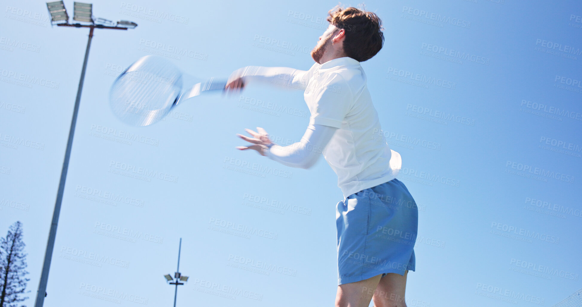 Buy stock photo Tennis, action or man outdoor with jump, racket practice and energy in training match. Fitness, padel competition and athlete outside with equipment, intense game and ball control in sports hobby