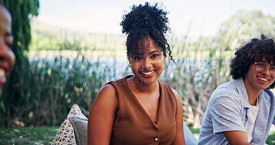 Buy stock photo Portrait, woman and happy at resort with friends for social gathering, conversation and bonding together. Person, smile and group outdoor in nature with summer holiday, weekend break and connection.