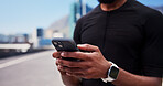 Hands, runner and phone for fitness in city, contact and smart watch with texting, break or tracking. Person, scroll and smartphone with mobile app, monitor and sky with exercise on bridge in town