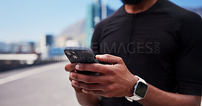Buy stock photo Hands, runner and phone for fitness in city, contact and smart watch with texting, break or tracking. Person, scroll and smartphone with mobile app, monitor and sky with exercise on bridge in town