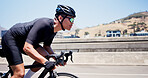 Man, bicycle and exercise on bridge in city, speed and helmet for training with sunglasses in summer. Person, cyclist and profile on bike, training and workout with cardio challenge in urban town