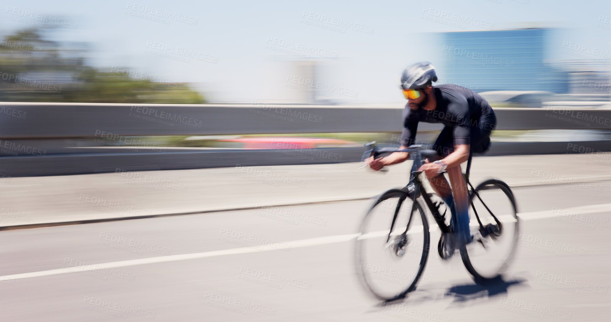 Buy stock photo Athlete, man and speed on bicycle in city for cycling exercise, endurance challenge and motion blur. Space, fast and cyclist with bike in road for triathlon fitness, sports performance and training