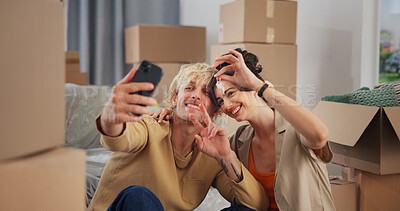 Buy stock photo Smile, couple and selfie with key at new house for photography, social media post and moving in. Happy, people and profile picture update with peace sign, property investment and relocation memory