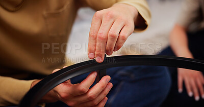 Buy stock photo Building, furniture and hands of couple in new home with screw for table, help and diy project. Closeup, remodeling and people with instructions in house for renovation and assembly in living room