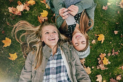 Buy stock photo Phone, reading and chat with friends in park for social media comment, post status update and text message. Communication app, online platform and bonding with above of girl outdoor as teenager