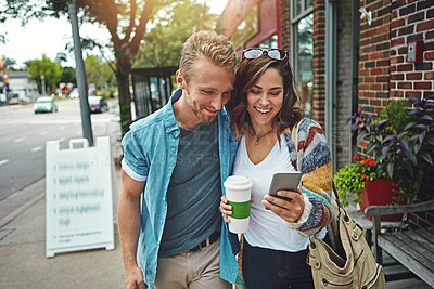 Buy stock photo Happy couple, walking or coffee with phone for funny joke, date or social media in city. Man, woman or smile with mobile smartphone app for humor, comedy or communication on sidewalk in an urban town