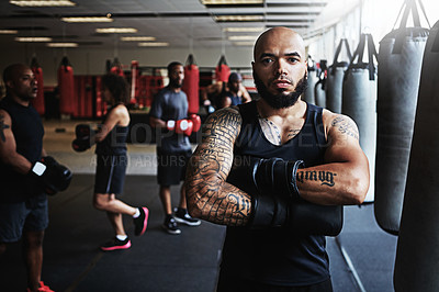 Buy stock photo Portrait, boxer and man with arms crossed in gym for sports, fitness or determination for combat. Boxing, professional athlete and serious person with gloves for exercise, workout and confidence