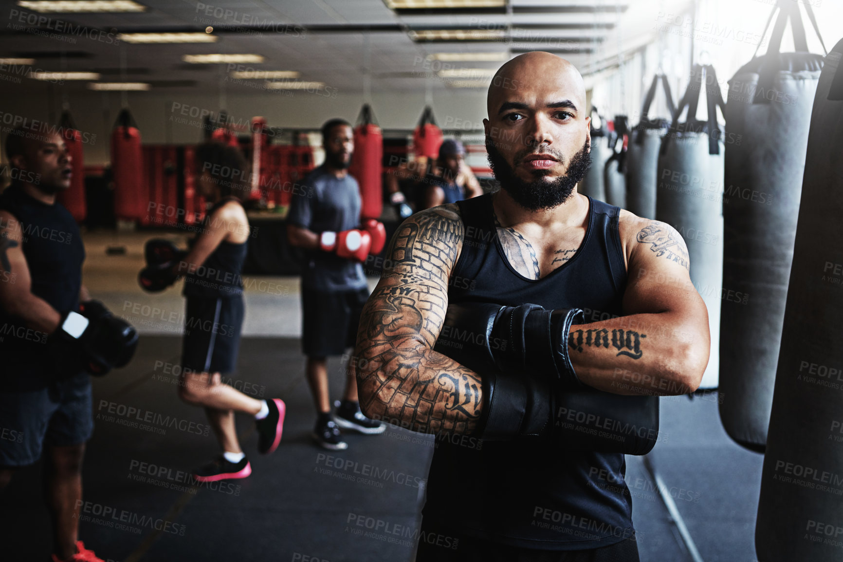 Buy stock photo Portrait, boxer and man with arms crossed in gym for sports, fitness or determination for combat. Boxing, professional athlete and serious person with gloves for exercise, workout and confidence