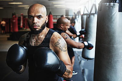 Buy stock photo Boxing class, man and punching bag in gym for fitness training, competition practice or self defense. People, pro boxer and portrait at health club for conditioning, fight preparation or combat sport