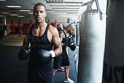 Buy stock photo Fitness, boxing and man in club for sports, portrait or workout with determined coach in gym. Boxer, professional athlete and serious person with gloves for fight training, exercise and trainer
