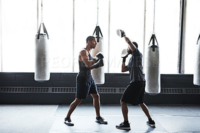 Buy stock photo Men, boxer and coach with practice in gym for fight preparation, skill development or fitness. Boxing, athlete and personal trainer at health club for sparring, competition training and combat sport