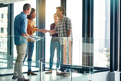 Buy stock photo Shaking hands, deal and business people in office with agreement, partnership or company merger. Greeting, meeting and team of creative editors with handshake for collaboration, welcome or teamwork.