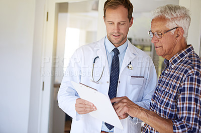 Buy stock photo Clipboard, checkup and doctor with elderly man in clinic for discussion on medical diagnosis. Checklist, consultation and healthcare worker with senior male patient for treatment planning in hospital
