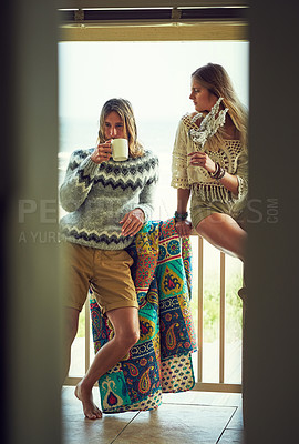 Buy stock photo Couple, bonding and man with coffee, balcony or romance with flowers on break, comfortable and love. Home, people and woman with floral gift, morning and beverage on weekend, relax and relationship