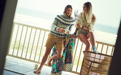 Buy stock photo Balcony, ocean and couple with coffee in home for bonding, relax and chill on weekend getaway. Beach house, dating and man with woman with drink on patio for holiday, vacation and love in morning