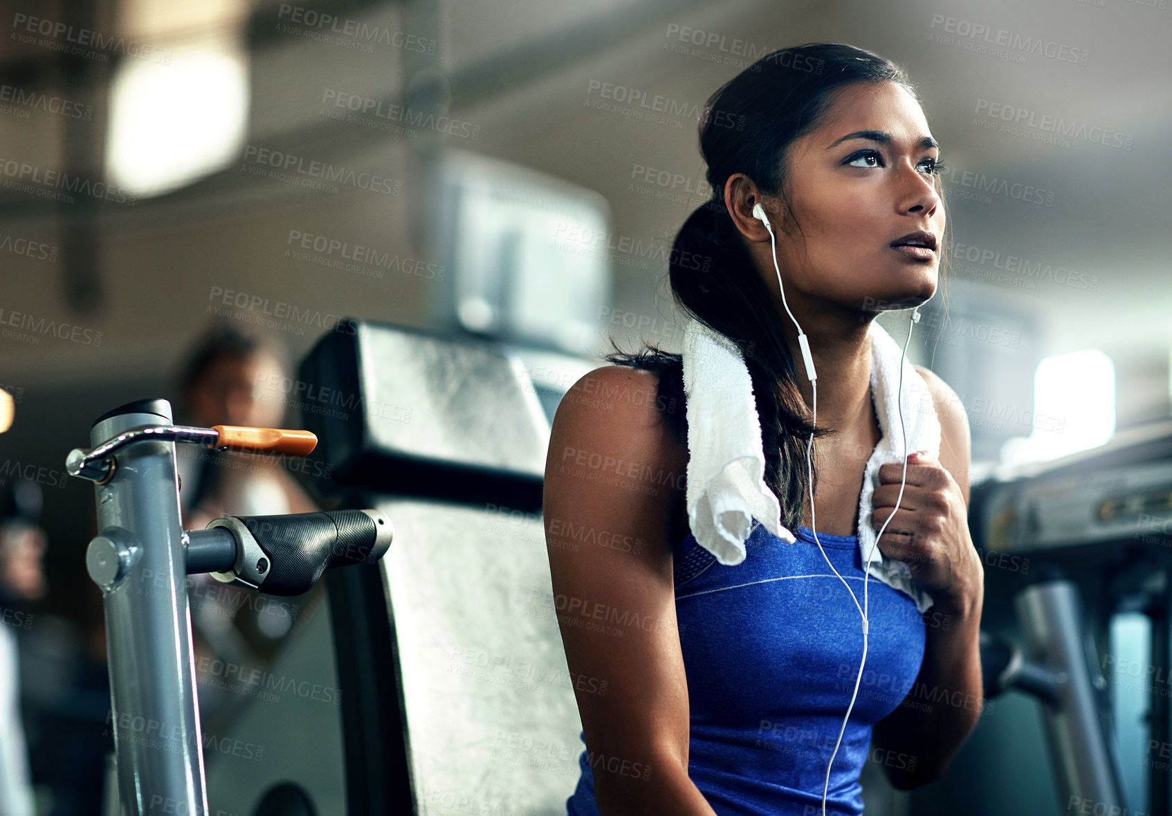 Buy stock photo Tired, fitness and woman in gym, earphones for podcast and exercise for health benefits. Listen, decision and person in wellness facility, training and streaming music with break, sound or reflection