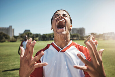 Buy stock photo Happy, winning and soccer playing screaming in joy during a match or training on an outdoor field. Success, fitness and excited man athlete at a football game with achievement or goal on sports pitch