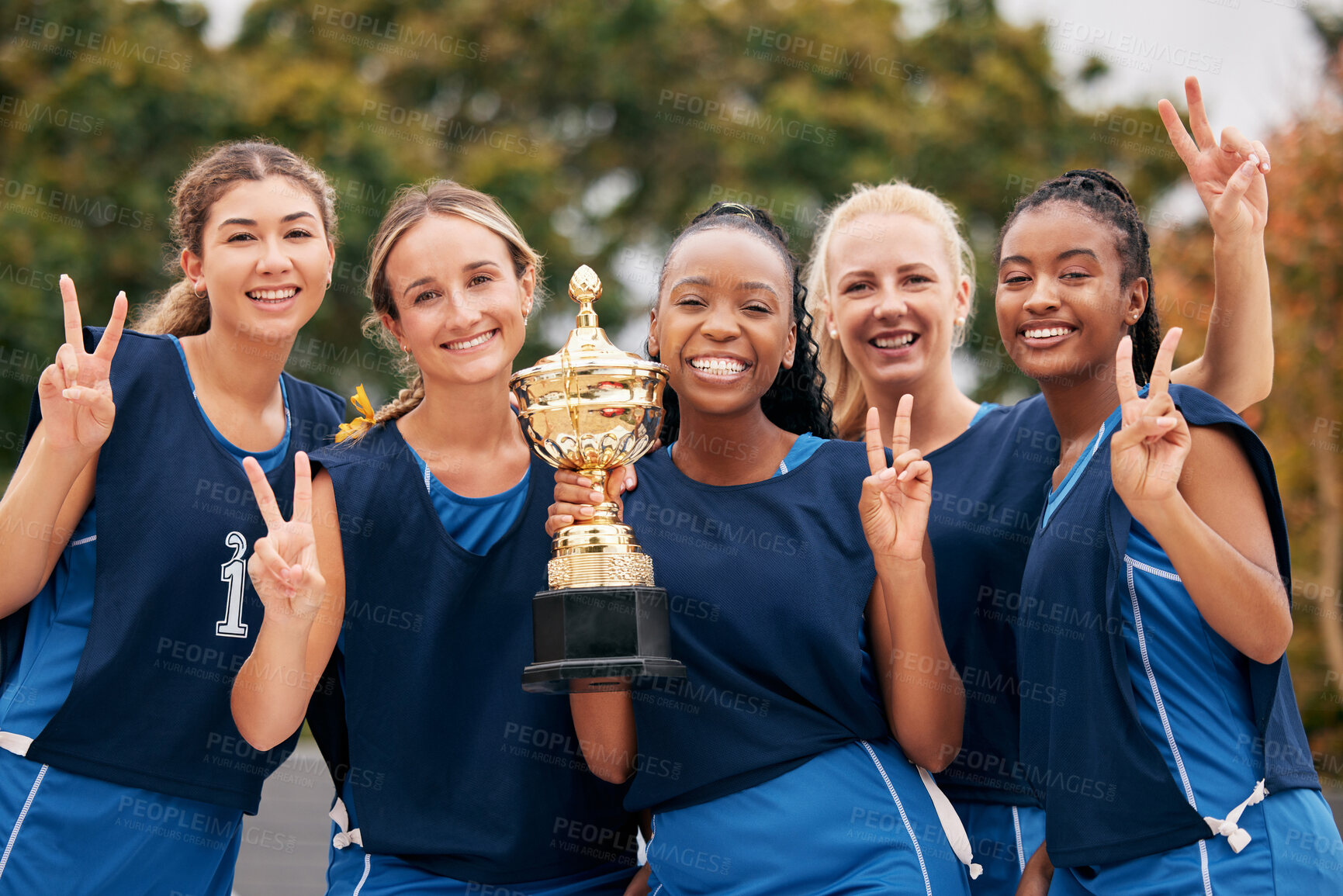 Buy stock photo Sports, netball and trophy with a woman team in celebration as a winner group of a victory or achievement. Peace, winning and teamwork with a female sport group celebrating success with a cup
