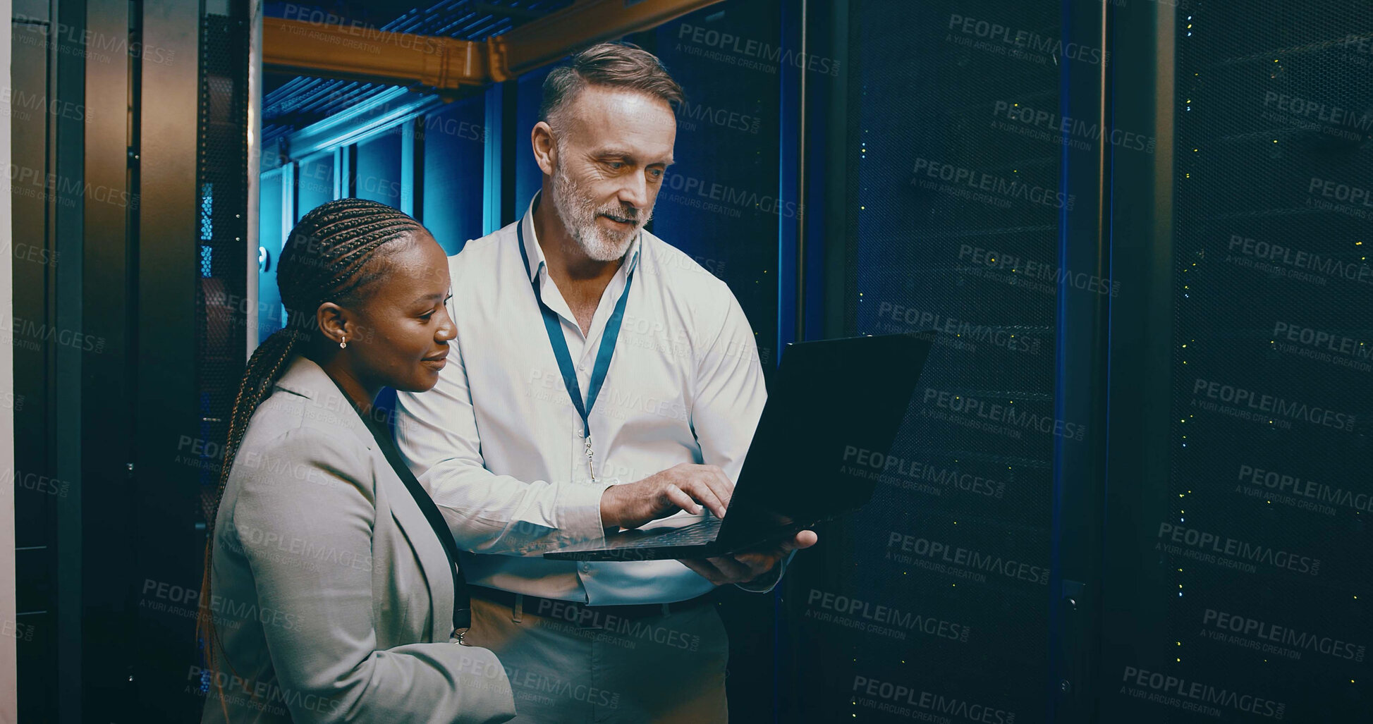 Buy stock photo Cybersecurity, laptop and maintenance with people in server room together for network upgrade. Collaboration, computer and conversation with tech support team in data center for administration backup