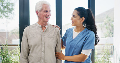 Buy stock photo Laughing, old man and caregiver in nursing home with funny story, conversation or wellness checkup. Smile, senior person or nurse in retirement center with joke, communication and healthcare support.