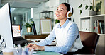 Happy woman, typing or listening with headphones for music, audio streaming or podcast in office. Female person, administrator or vibe with smile for sound playlist, tune or software app in workplace