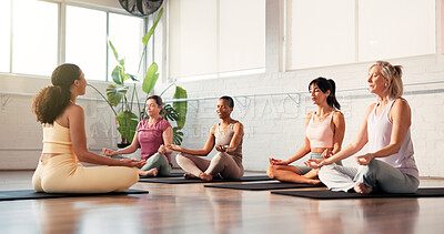 Buy stock photo Woman, yoga class and lotus meditation with coach, breathing exercise and routine on gym floor. People, zen and mudra with holistic fitness, teacher or mindfulness with guide on mat at wellness club