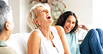 Laughing, friends or senior woman on couch for reunion, share funny story or comic experience together. Happy, retirement or old people with bonding at gathering in home, weekend visit and humor chat